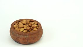 Close up of roasted and salted peanuts bowl