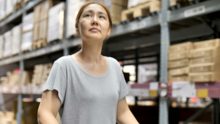4K Slow motion Asian woman rides shopping cart through the warehouse, Choosing new furniture
 | Shutterstock HD Video #1010200358