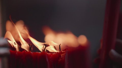 People light up candle in slow motion