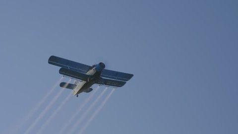 Old crop duster flying overhead.
