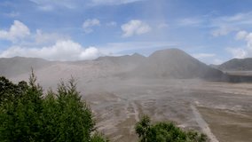 4K Cinematic Time Lapse of Magnificent Bromo with dancing clouds and dust movement. Bromo is an active volcano situated at Bromo Tengger Semeru National Park East Java Indonesia.
