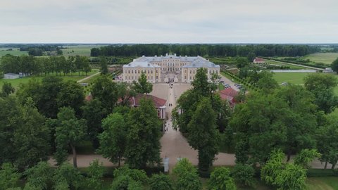 Castle park Rundale in Latvia drone flight above trees, summer time
