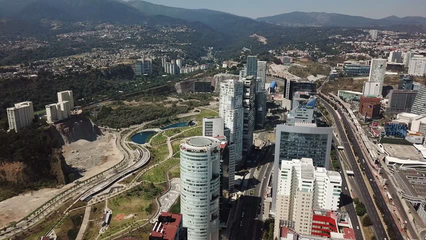 Aerial view of Santa Fe Mexico buildings and skyscrapers with mountain as background 