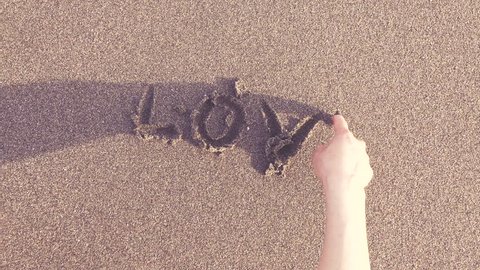 Vanishing letters of Love on the beach