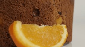 Slice of orange and Italian cake called panettone 4K video