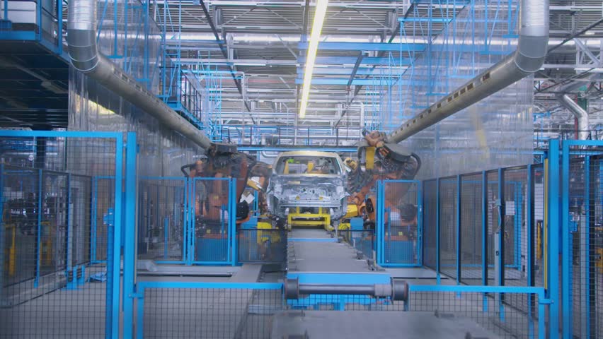 Slow motion industrial. Robots working on a car factory production line | Shutterstock HD Video #1010235872