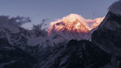 Greatness of nature concept: grandiose view of Everest peak (8848 m) at sunset. Time Lapse zoom in. Nepal, Himalayan mountains, the highest point of the planet.