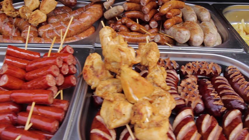 french fries with sausages on food festival