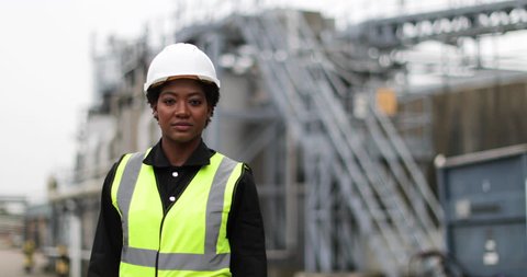 Portrait of female industrial worker on site