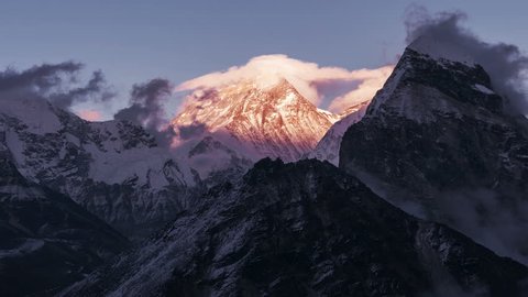 Greatness of nature: grandiose view of Everest peak (8848 m) at sunset. Time Lapse zoom in. Nepal, Himalayan mountains, the highest point of the planet.