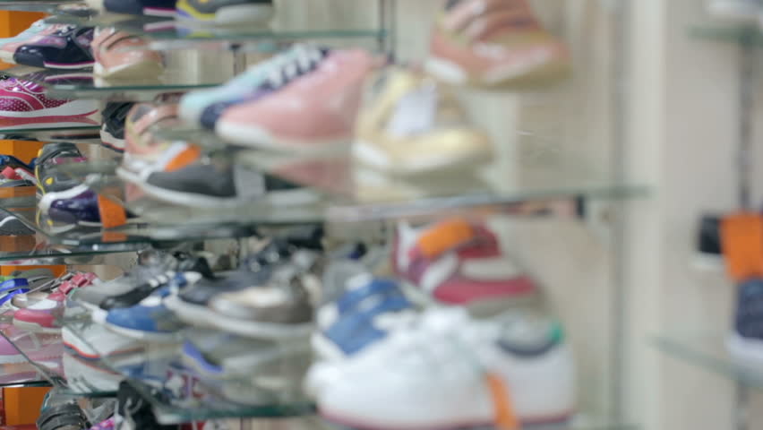 Shoes on shelves at shoe store