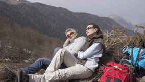 Hikers relaxing in the mountains during journey