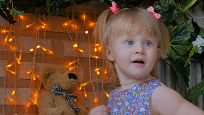 Portrait of funny little girl at home. Family, childhood and leisure concept