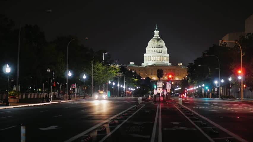 Capitol at night, traffic machines. View from from Pennsylvania Avenue. Washington, DC