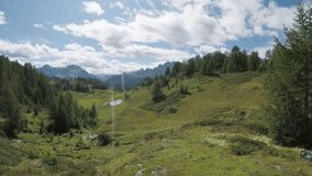 POV walking to look at panorama.Exploring trail path near mountains.Electrical bike active people sport travel vacation in Europe Italy Alps outdoors in summer.4k video