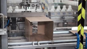 Cardboard boxes on conveyor belt in factory. Clip. Cardboard boxes on conveyor belt in factory