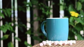 hot drink coffee on table closeup fresh morning blur green garden background