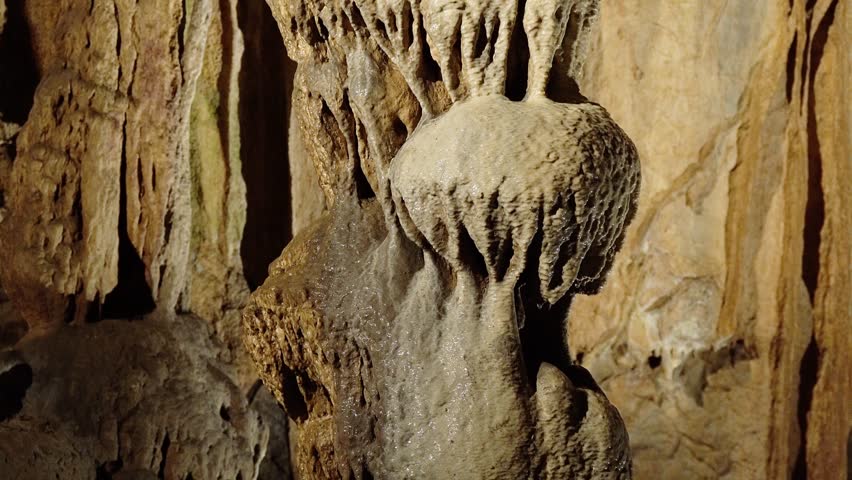 stalactites inside the cave, Descent into underground cave with stalactites and stalagmites, White stalactites inside cave, Underground cave world is amazing with its magnificance