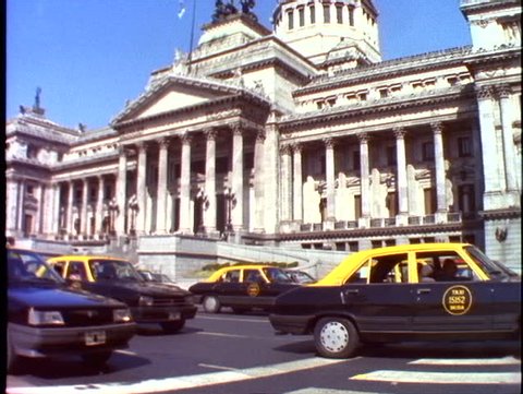 ARGENTINA, 1998, Congress of medium shot with taxis in foreground, tilt up, Buenos Aires