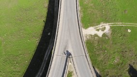aerial view of bridge and car driving on the road. Romania