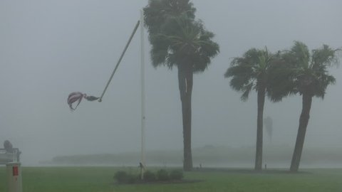 Rockport, TX/US - August 26, 2017 [Major Hurricane Harvey making landfall in Rockport, Texas. Hurricane winds, storm surge flooding along the coastal homes. Snapped flagpole in wind.]