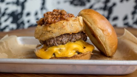 Melting cheese on hamburger in restaurant Cinemagraph