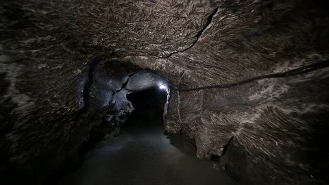 A cave, a dungeon. Speleology, a cave, a dungeon, a dark tunnel, excavations underground