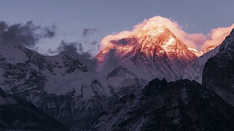 Greatness of nature: time lapse grandiose view of Everest peak (8848 m) at sunset. Nepal, Himalayan mountains, the highest point of the planet.