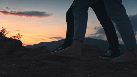 Two toutists legs going on the hill and looking at the view Video Stok