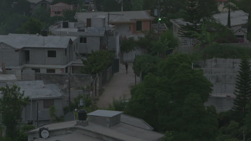 Silhouette Of Female Walking IN Caribbean Village