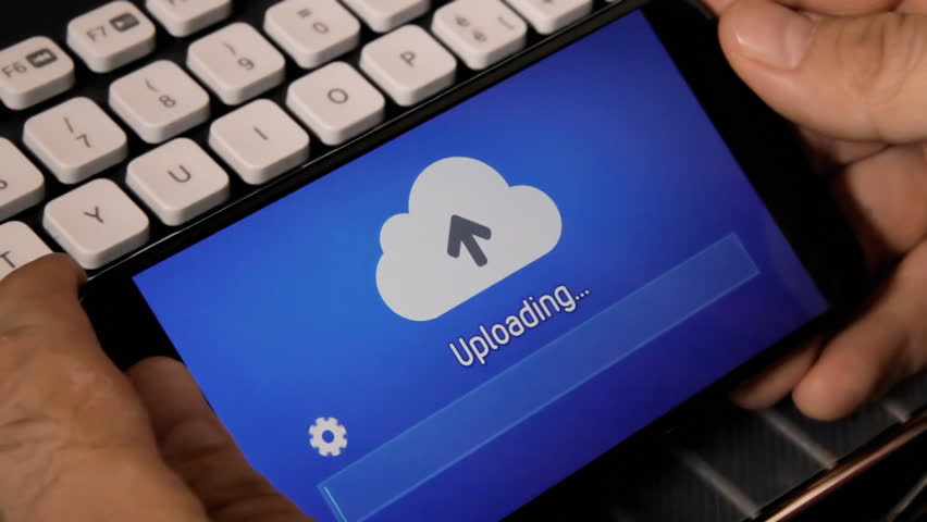Browsing or watching on a smartphone: uploading a file or resource to the cloud. Rainbow background.
 Royalty-Free Stock Footage #1010370281