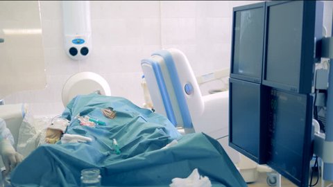 Surgeons use modern equipment to perform difficult heart surgeries. 4K.