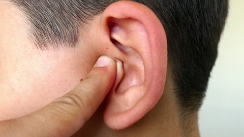 scratching the ear with a finger, ear diseases, ear pain,