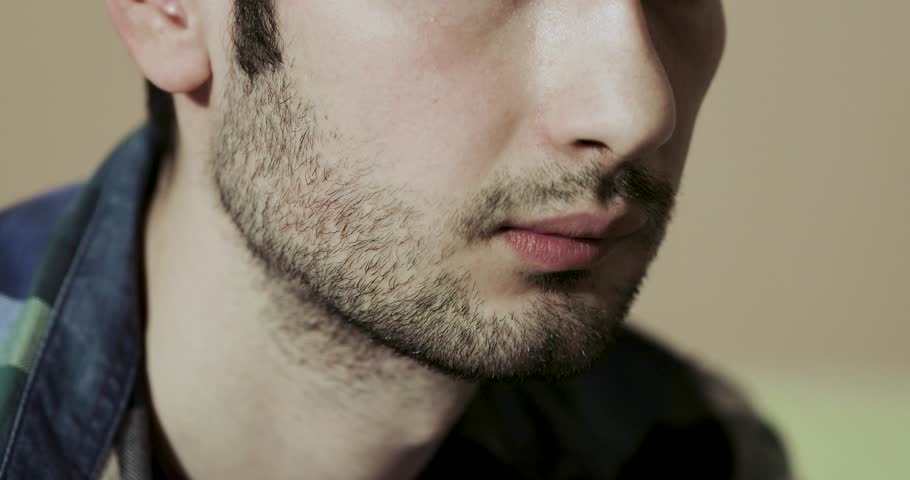 bearded man smoking hookah close up