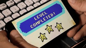 Browsing or watching on a smartphone: a videogame screen, 8 bit retro style, saying Level completed. Smiling stars over a pixel animation.
 - Powered by Shutterstock - Get 15% off with code: PIKWIZARD15