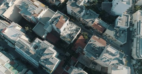 4K Athens aerial downtown buildings rooftops.Aerial views of tight concrete buildings and vertical views of, typical downtown neighbourhoods streets and rooftops near the center of Athens.