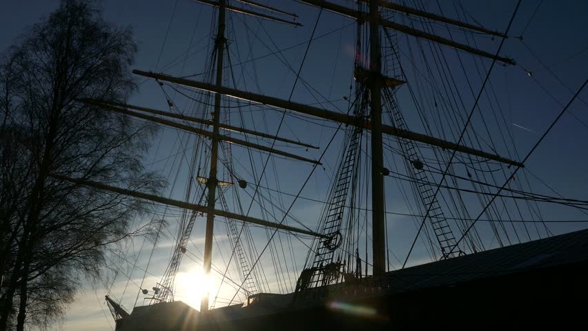 The harbour at Mariehamn Aland Islands Finland with the silhouette old tall ship Pommern in the foreground