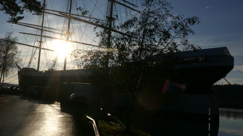 The harbour at Mariehamn Aland Islands Finland with the silhouette old tall ship Pommern in the foreground
