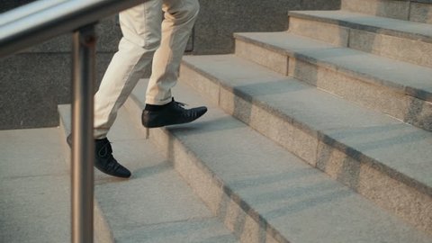 Walking upstairs: close-up view of man's leather shoes business stairs run walk