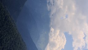 Vertical video. Clouds in the mountains. Zoom. Time Lapse. Sochi, Russia