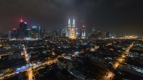 Time lapse: Night view of a Kuala Lumpur city skyline with busy light trails in Malaysia. 4k resolution