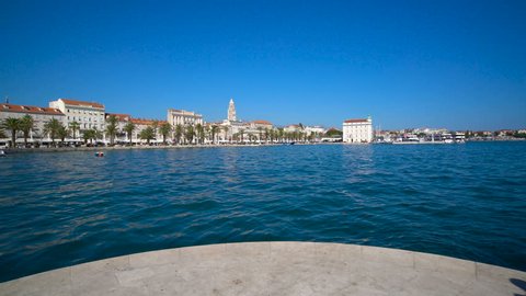 Woman traveller travels in Split,Croatia with panoramic view of Split old town. Split is the second-largest city of Croatia and prominent travel destination for historic center of Croatia cultures.