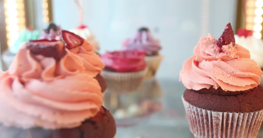 Delicious cakes and desserts in a shop window in the confectionery
