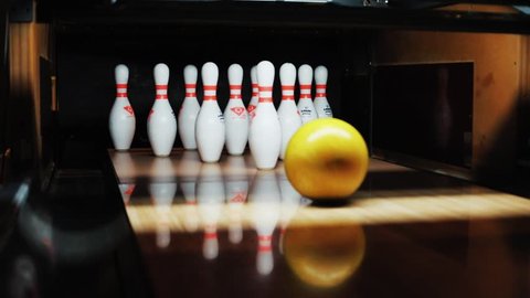 NEW YORK - April 5, 2018:Close up of the bowling track strike ball lane spare bowl down halfway knocks playback sports winner alley floor fun game indoor leisure relaxation bowling alley bowling