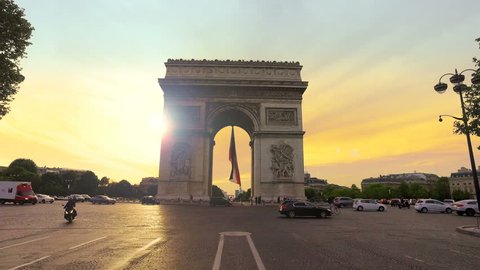 Paris, France - 5 May, 2017: Arch Of Triumph and Traffic at sunset in Paris France.Cinematic Steadicam Motion