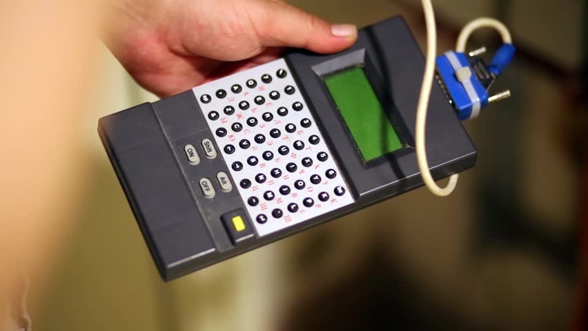 Tuning meter in hands of the worker, establishing intercom.