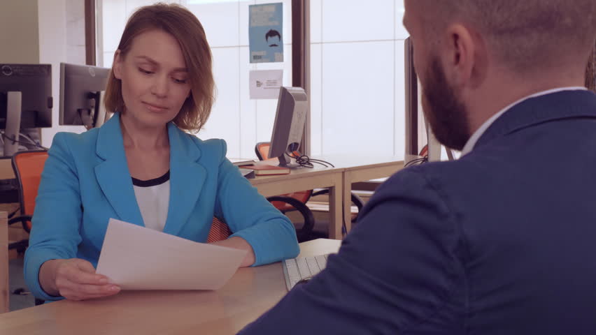 candid woman manager in bank giving document with cheerful smile client signing contract. business people shaking hands in modern office after great deal. meeting with estate agent Royalty-Free Stock Footage #1010439794
