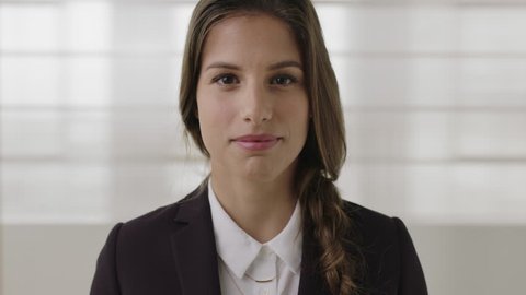 beautiful business woman portrait of young caucasian female intern smiling happy looking at camera wearing stylish formal suit real people series
