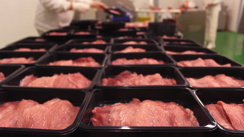 Meat processing in food industry,Packaging meat on the production line at the factory  Royalty-Free Stock Footage #1010444726