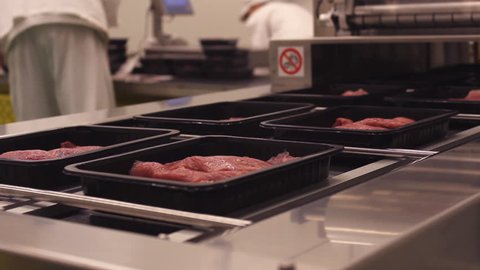 Meat processing in food industry,Packaging meat on the production line at the factory 
